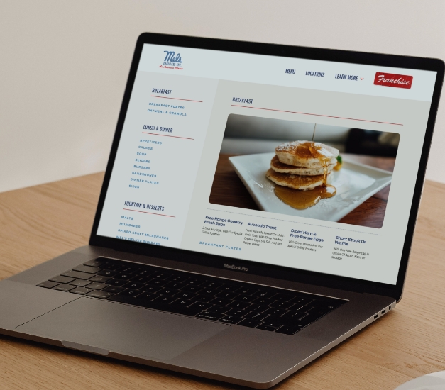 A laptop with Mel's Drive In menu opened